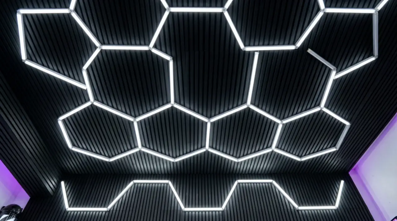 The shop's honeycomb of white hexagon LED lights over black slat panels